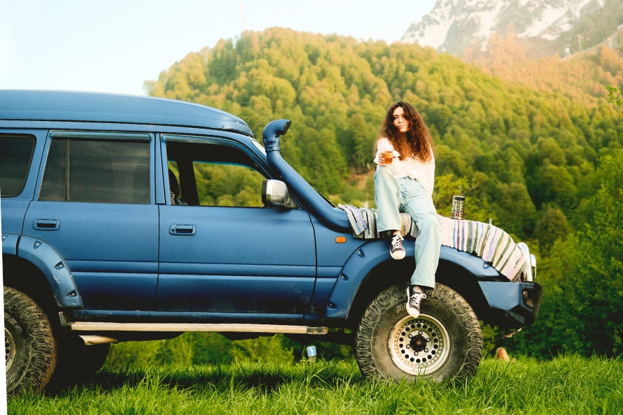 Woman Driving a 4x4 Car