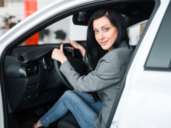 Woman Driving a White Car