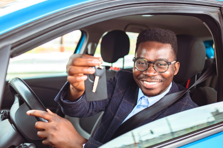 Man Driving a Blue Car